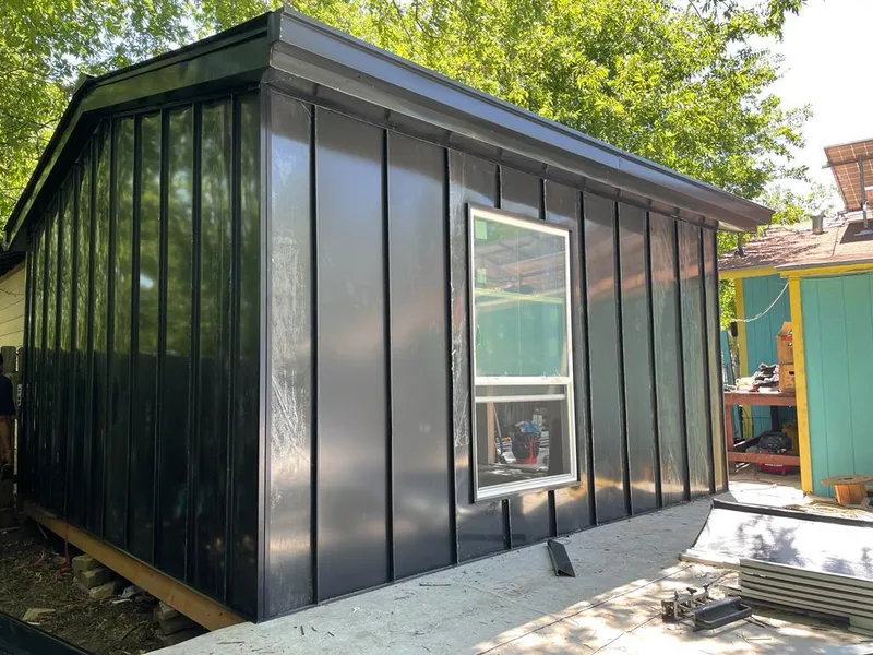 Black standing seam metal wall panels for Roof Inspection in Kaser